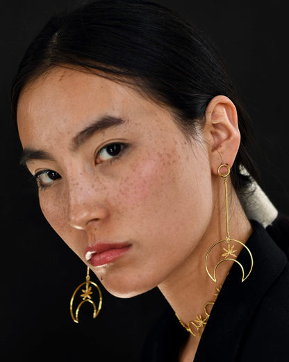 Gold Brass Linear Moon Long Earrings at Kamakhyaa by The Loom Art. This item is Brass, Cosmic Dream TLA, Fashion Jewellery, Free Size, Gold, Gold Plated, jewelry, Less than $50, Long Earrings, Natural