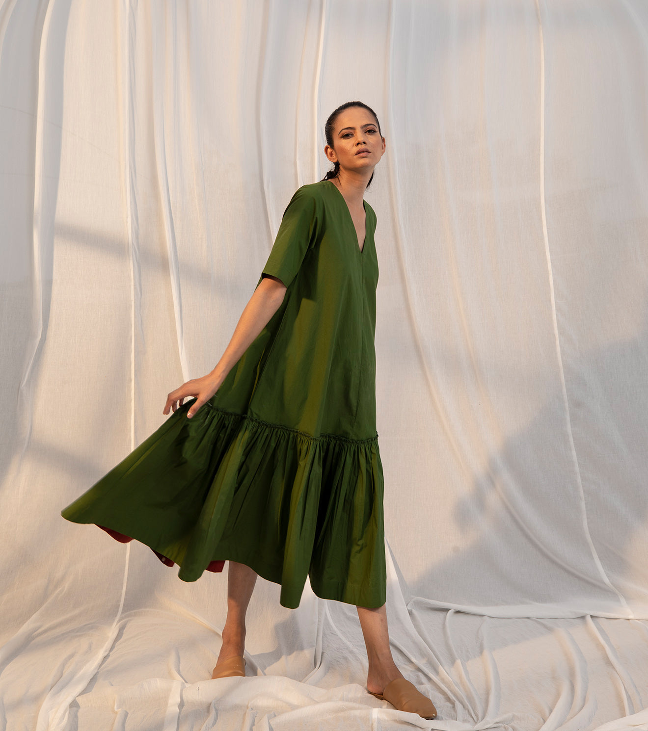 Green Tiered Midi Dress at Kamakhyaa by Khara Kapas. This item is Evening Wear, Green, Midi Dresses, Natural, Poplin, Regular Fit, Sienna KK, Solid Selfmade, Solids, Tiered Dresses, Womenswear