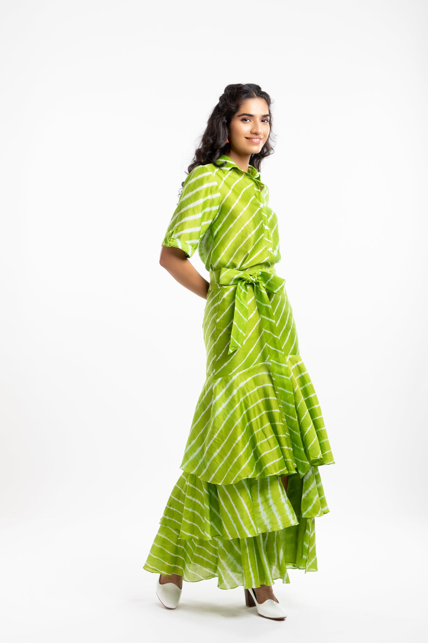 Green Tiered Ruffled Skirt at Kamakhyaa by House Of Ara. This item is Casual Wear, Chanderi, Fitted at Waist, Green, Leheriya, Leheriya Collection, Maxi Skirts, Natural, Prints, Skirts, Stripes, Womenswear
