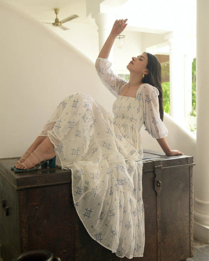 White Cotton Tiered Dress at Kamakhyaa by Taro. This item is Best Selling, Evening Wear, FB ADS JUNE, Handwoven cotton, Indo-Western, July Sale, July Sale 2023, Natural, Prints, Regular Fit, Tiered Dresses, White, Wildflower Taro, Womenswear
