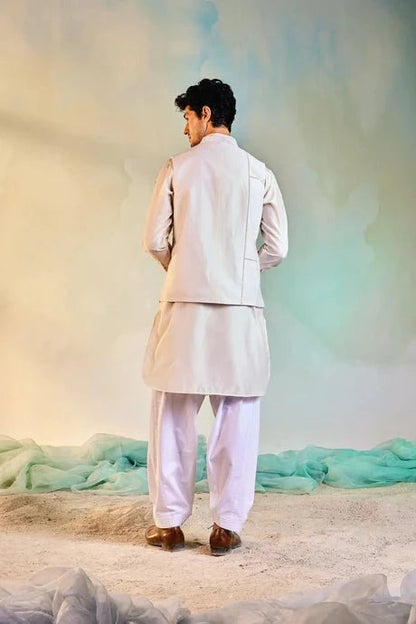 White Kurta Salwar Set at Kamakhyaa by Charkhee. This item is Aasmaa, Chanderi, Cotton, Embellished, Kurta Salwar Sets, Mens Co-ords, Menswear, Natural, Organza, Relaxed Fit, Sequin work, Wedding Wear, White