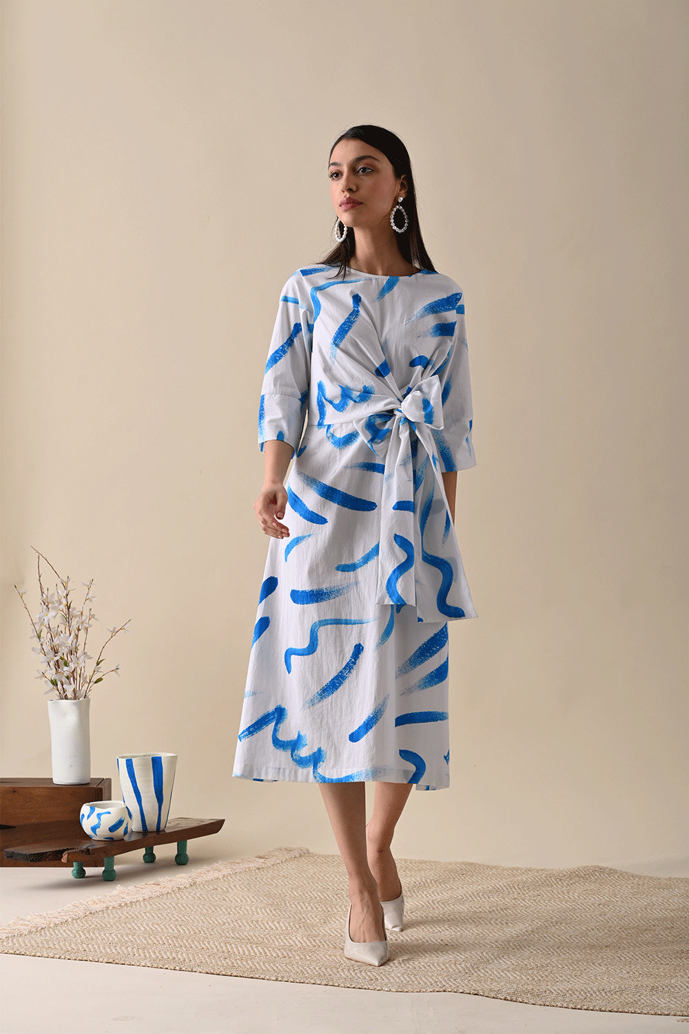 White Midi Dress at Kamakhyaa by Kanelle. This item is Best Selling, Casual Wear, Dresses, For Her, July Sale, Life in Colours, Midi Dresses, Natural with azo dyes, Organic Cotton, Prints, Regular Fit, White, Womenswear, Wrap Dresses