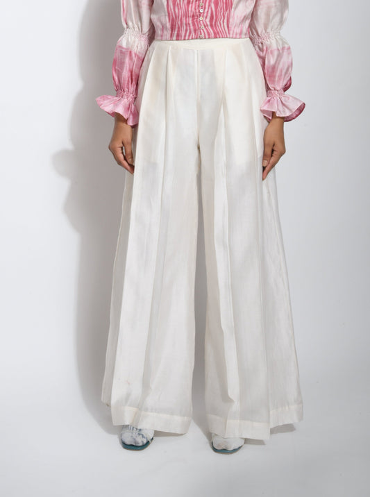 White Pants at Kamakhyaa by The Loom Art. This item is Best Selling, Between the Lines, Chanderi Silk, July Sale, July Sale 2023, Natural, Palazzo Pants, Party Wear, Regular Fit, Solids, White, Womenswear