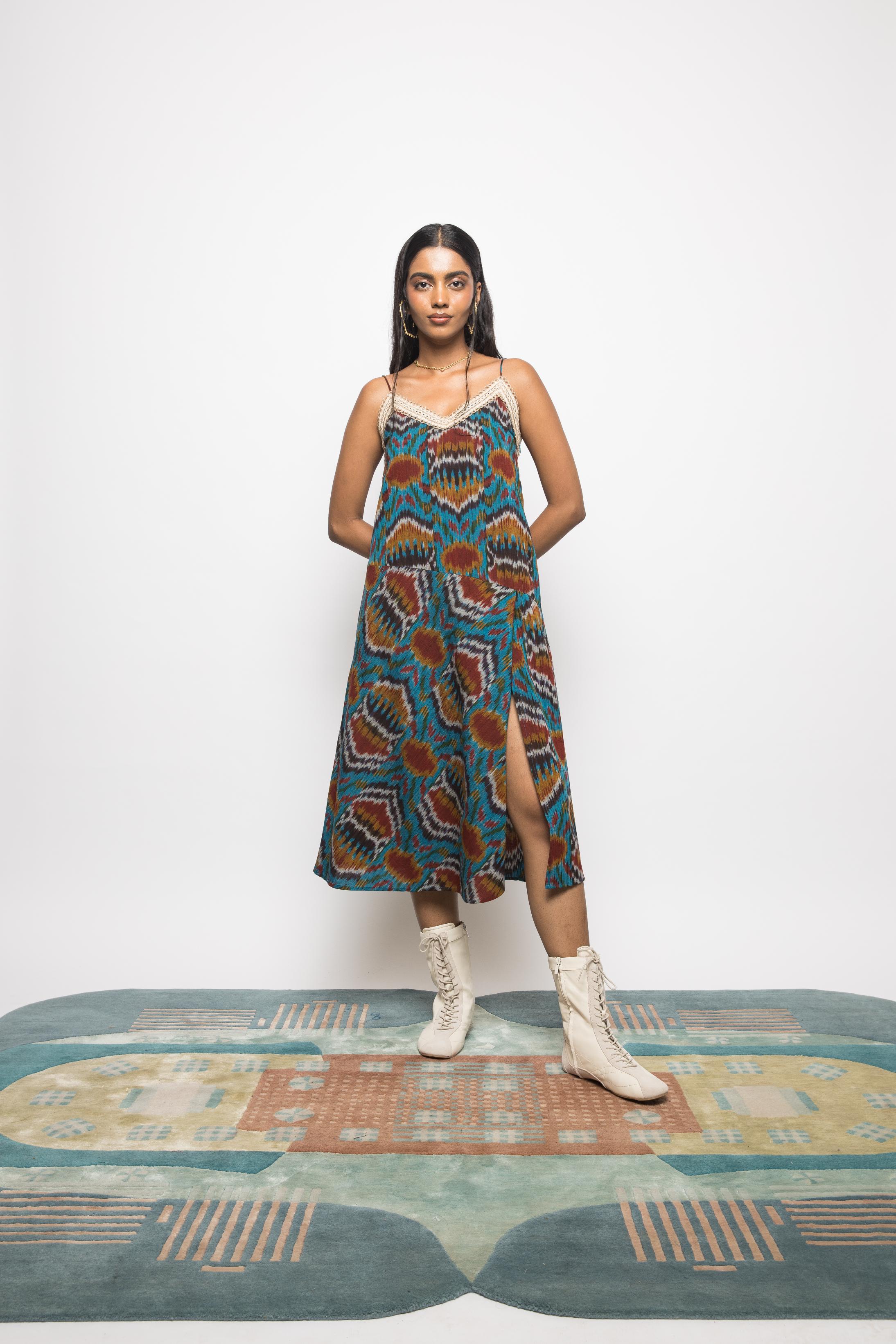 Asymmetric Waist Sling Dress at kamakhyaa.com by Anushé Pirani. This item is 100% Cotton, Beach Wear, Brunch Wear, Casual Wear, Console Collection List, Cotton, Fresh Ink by Anushe Pirani, Handwoven cotton, Ikat Prints, Regular Fit, Resort Wear, Turquoise, Vacation Wear, Womenswear