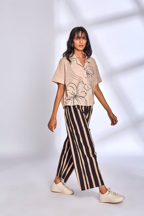 Beige Co-ord Set with Striped Pants at Kamakhyaa by Hasttvam. This item is Cotton, Floral, Fusion Wear, Handmade by Artisans, Natural dyes, Relaxed Fit, Respondible production and Vegan, White