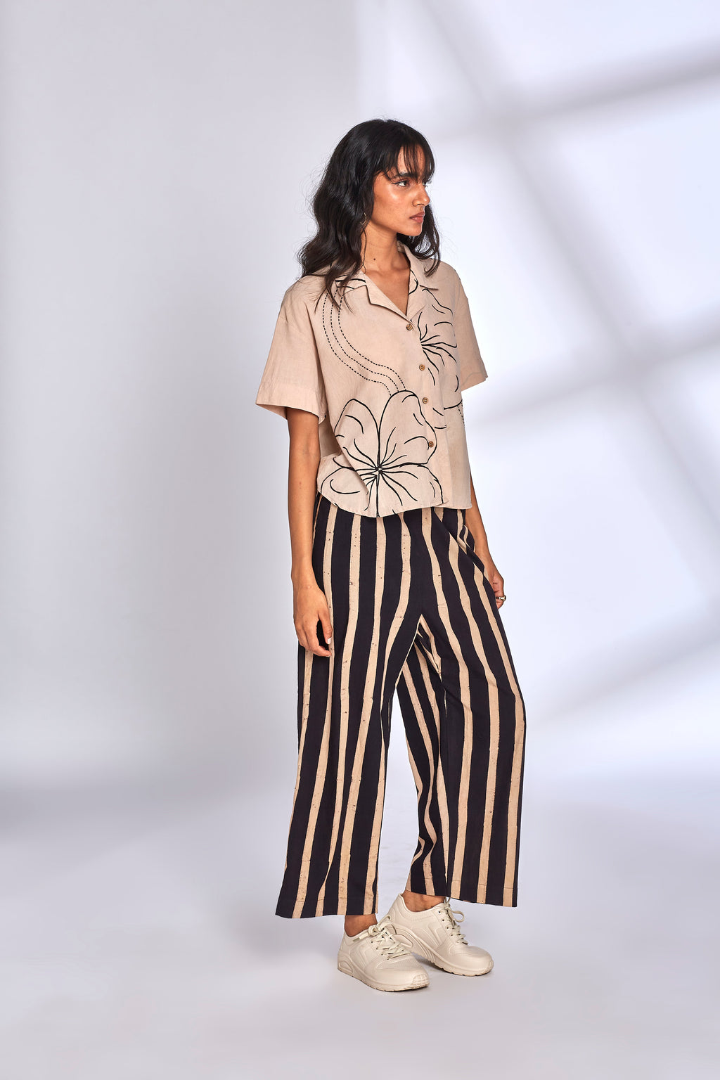 Beige Co-ord Set with Striped Pants at Kamakhyaa by Hasttvam. This item is Cotton, Floral, Fusion Wear, Handmade by Artisans, Natural dyes, Relaxed Fit, Respondible production and Vegan, White