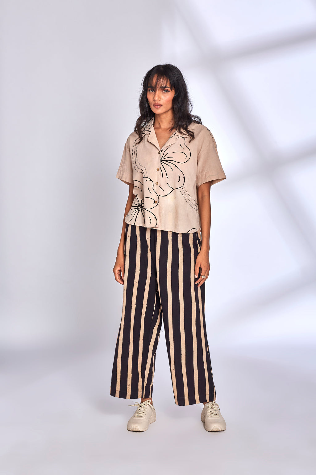 Beige Co-ord Set with Striped Pants at Kamakhyaa by Hasttvam. This item is Cotton, Floral, Fusion Wear, Handmade by Artisans, Natural dyes, Relaxed Fit, Respondible production and Vegan, White