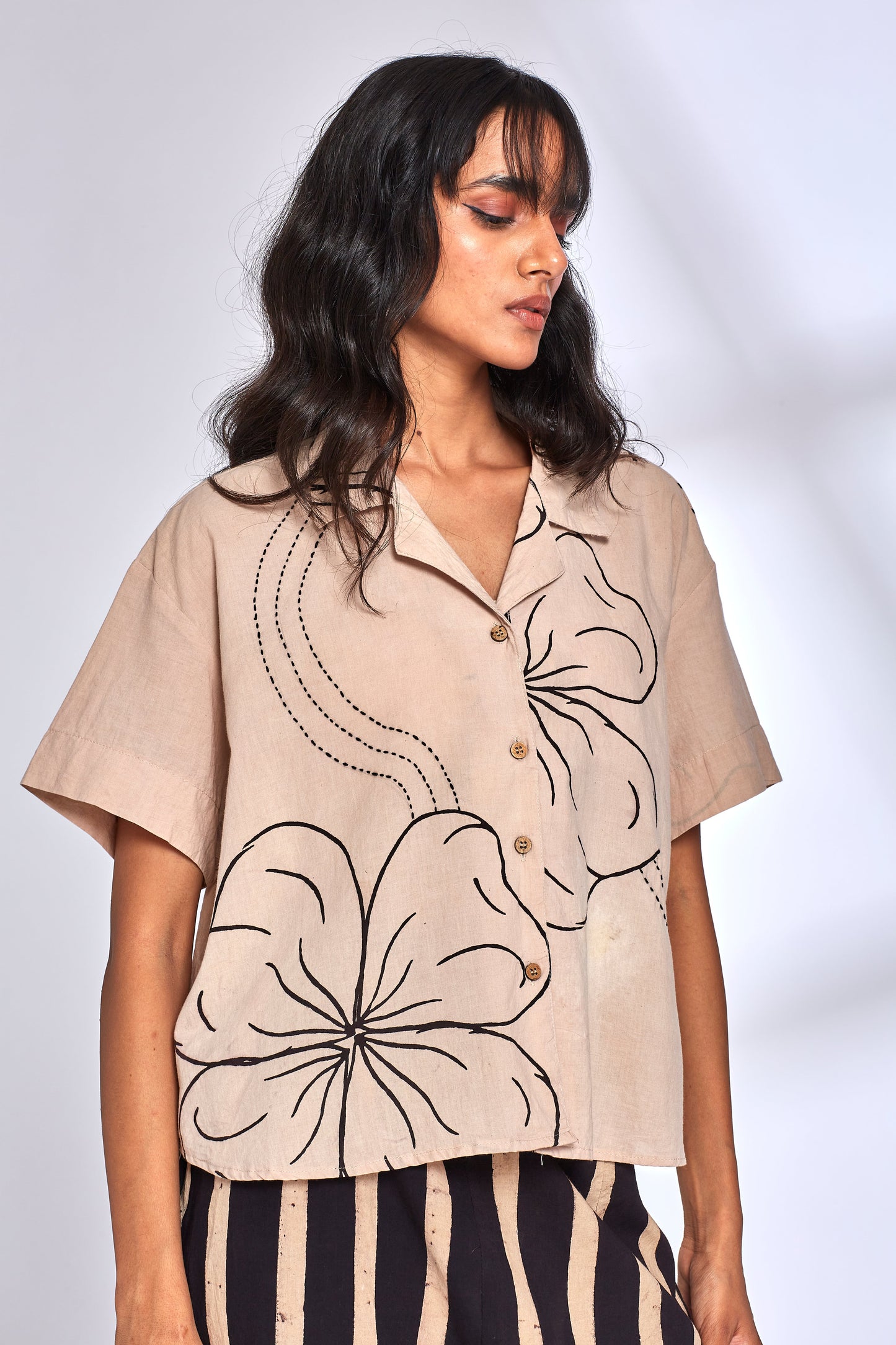 Beige Shirt for Women at Kamakhyaa by Hasttvam. This item is CottonFloralFusionWhiteHandmade by artisans, Floral, Natural dyes, Relaxed Fit, Respondible production and Vegan