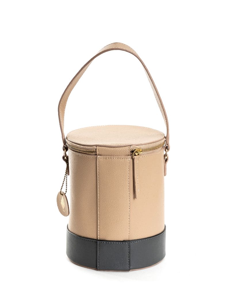 Beige Solid Bucket Bag at Kamakhyaa by Green Hermitage. This item is Apple Leather, Beige, Bucket Bags, Casual Wear, Free Size, Hemp, Lyocell, Recycled, Solids