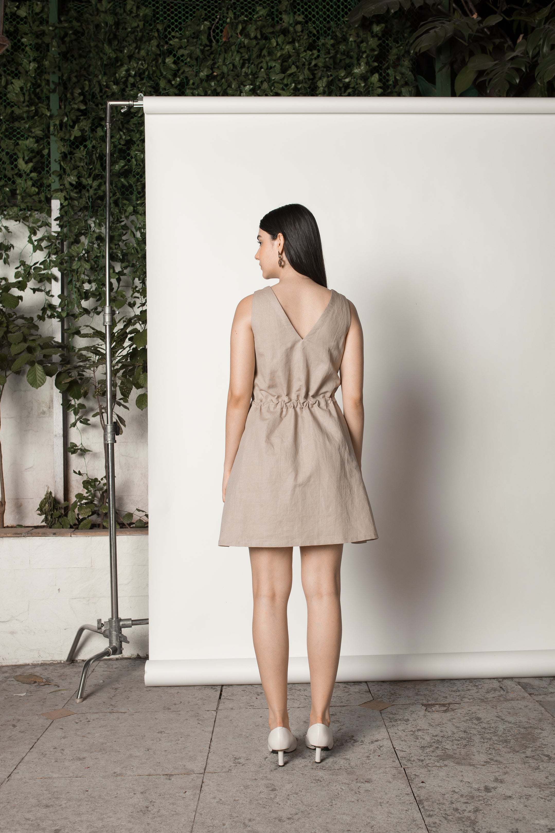 Beige Sundress with Drawstring at kamakhyaa.com by Anushé Pirani. This item is Beige, Birthday Collection, Casual Wear, Console Collection List, Cotton, Dresses, Hemp, Mini Dresses, Nostalgic Whispers by Anushe Pirani, Office Formals, Regular Fit, Review September 2025, Sleeveless Dresses, Solids, Womenswear