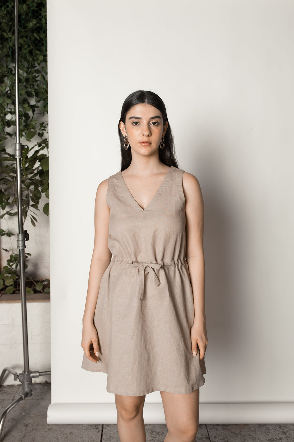 Beige Sundress with Drawstring at kamakhyaa.com by Anushé Pirani. This item is Beige, Birthday Collection, Casual Wear, Console Collection List, Cotton, Dresses, Hemp, Mini Dresses, Nostalgic Whispers by Anushe Pirani, Office Formals, Regular Fit, Review September 2025, Sleeveless Dresses, Solids, Womenswear