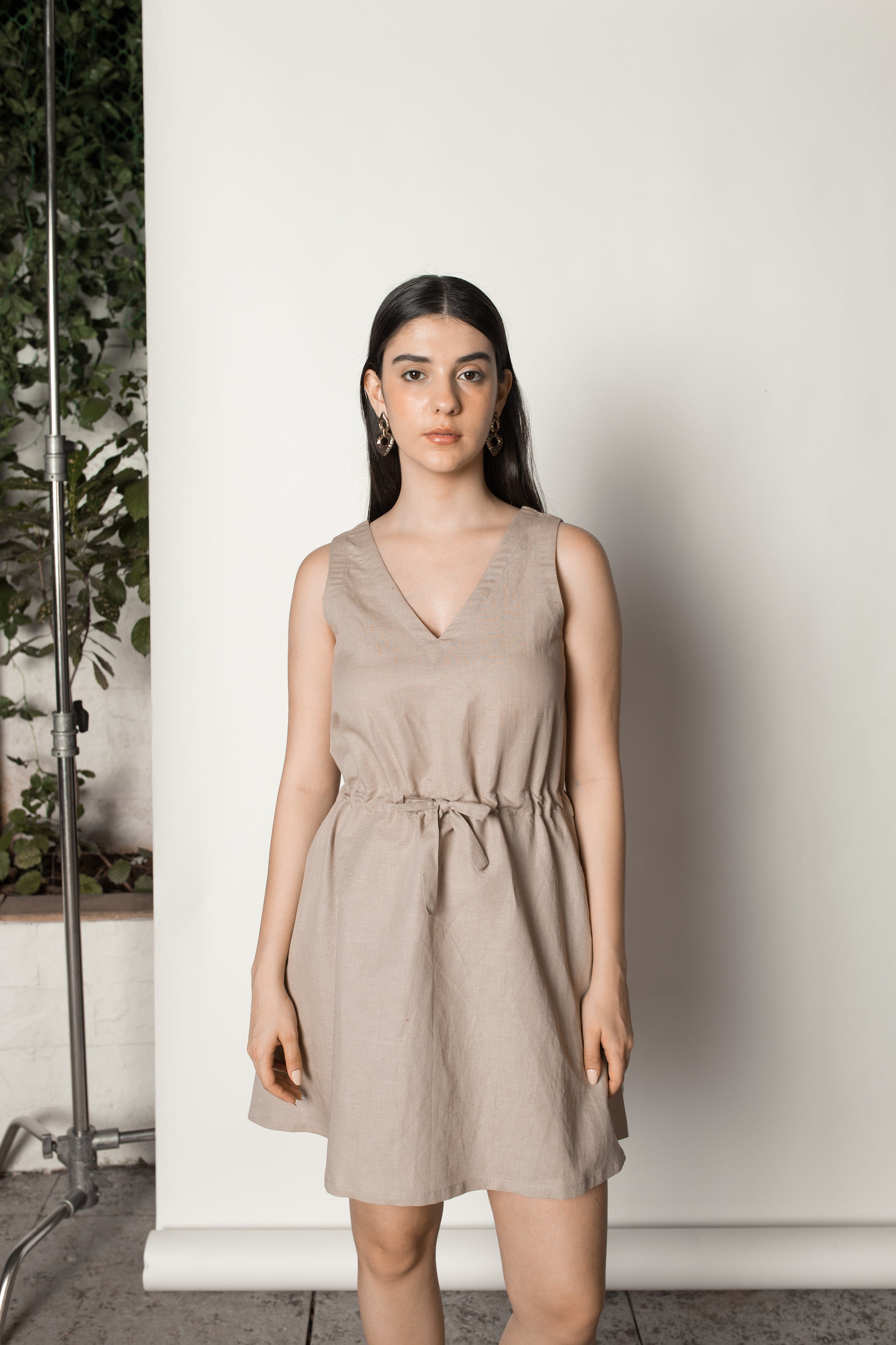 Beige Sundress with Drawstring at kamakhyaa.com by Anushé Pirani. This item is Beige, Birthday Collection, Casual Wear, Console Collection List, Cotton, Dresses, Hemp, Mini Dresses, Nostalgic Whispers by Anushe Pirani, Office Formals, Regular Fit, Review September 2025, Sleeveless Dresses, Solids, Womenswear