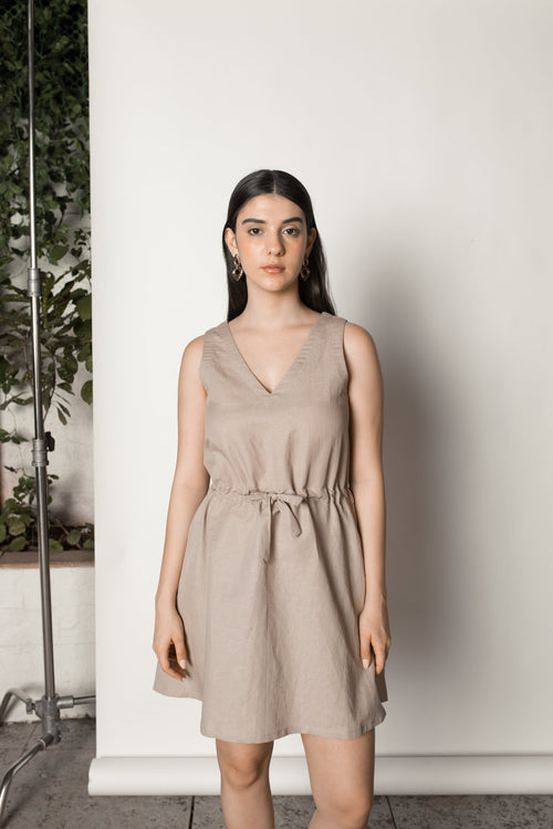 Beige Sundress with Drawstring at kamakhyaa.com by Anushé Pirani. This item is Beige, Birthday Collection, Casual Wear, Console Collection List, Cotton, Dresses, Hemp, Mini Dresses, Nostalgic Whispers by Anushe Pirani, Office Formals, Regular Fit, Review September 2025, Sleeveless Dresses, Solids, Womenswear