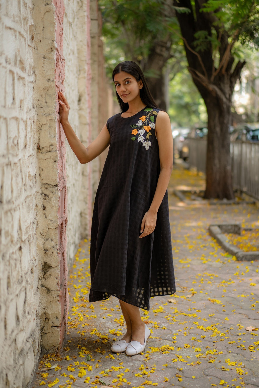 Black A-line Dress with Floral Hand-Embroidery at Kamakhyaa by Krushnachuda. This item is Black, Chilika by Krushnachuda, Embroidered, Handloom Cotton, Loose Fit, Natural Dye, Organic, Outerwear, Under $200, Womenswear