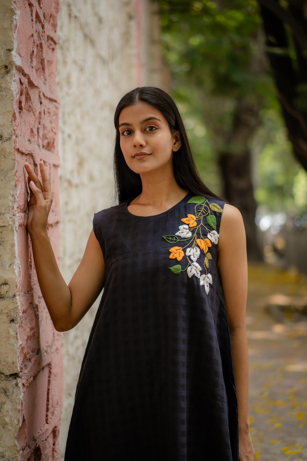 Black A-line Dress with Floral Hand-Embroidery at Kamakhyaa by Krushnachuda. This item is Black, Chilika by Krushnachuda, Embroidered, Handloom Cotton, Loose Fit, Natural Dye, Organic, Outerwear, Under $200, Womenswear