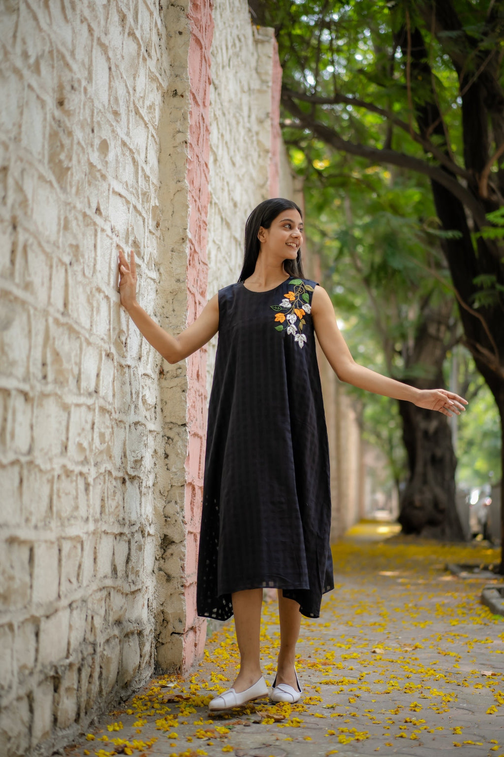 Black A-line Dress with Floral Hand-Embroidery at Kamakhyaa by Krushnachuda. This item is Black, Chilika by Krushnachuda, Embroidered, Handloom Cotton, Loose Fit, Natural Dye, Organic, Outerwear, Under $200, Womenswear