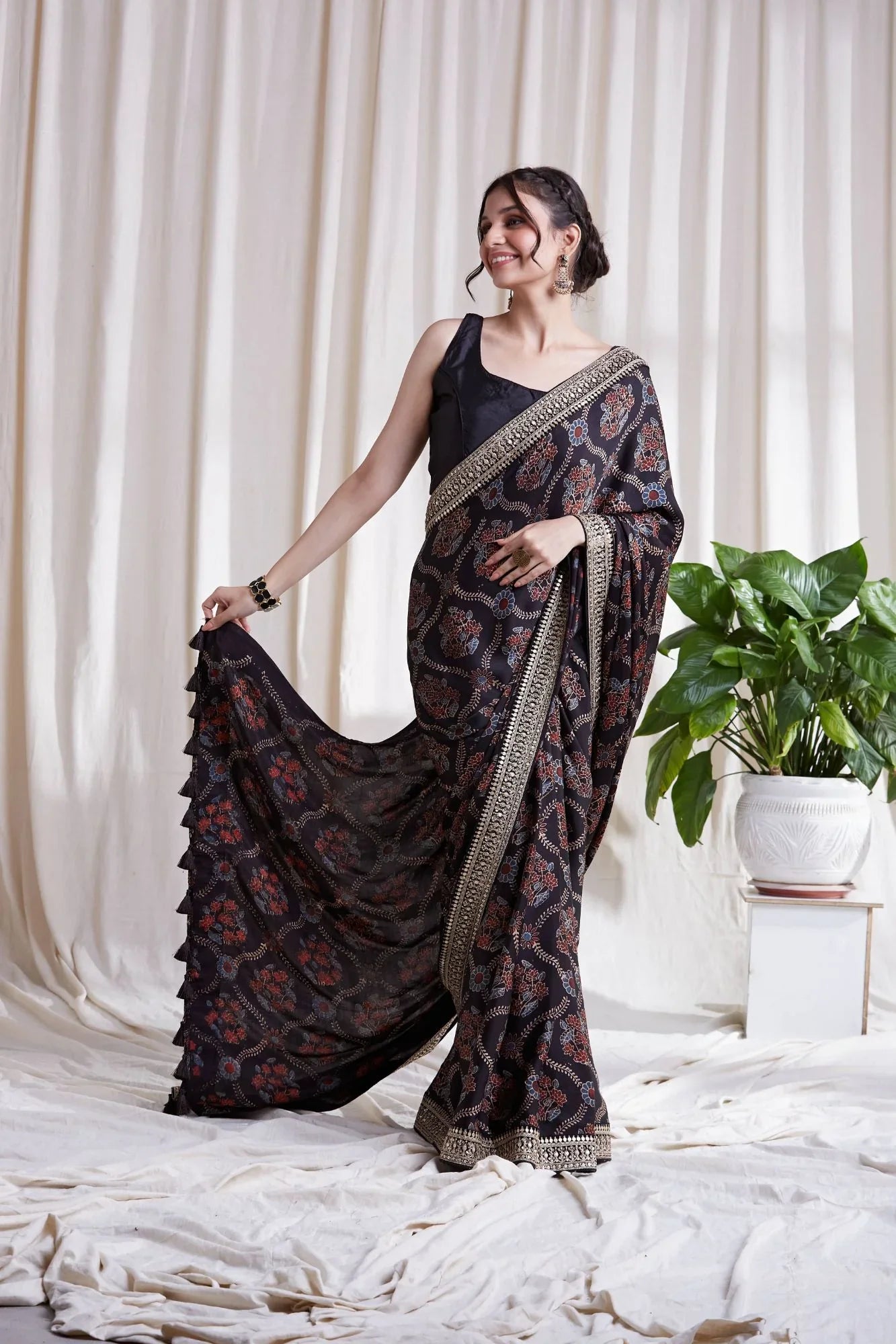 Black Hand Block Printed Saree at Kamakhyaa by Hasttvam. This item is Black, Festive Wear, Floral, Handmade by Artisans, Modal silk, Natural dyes, Relaxed Fit, Respondible production and Vegan