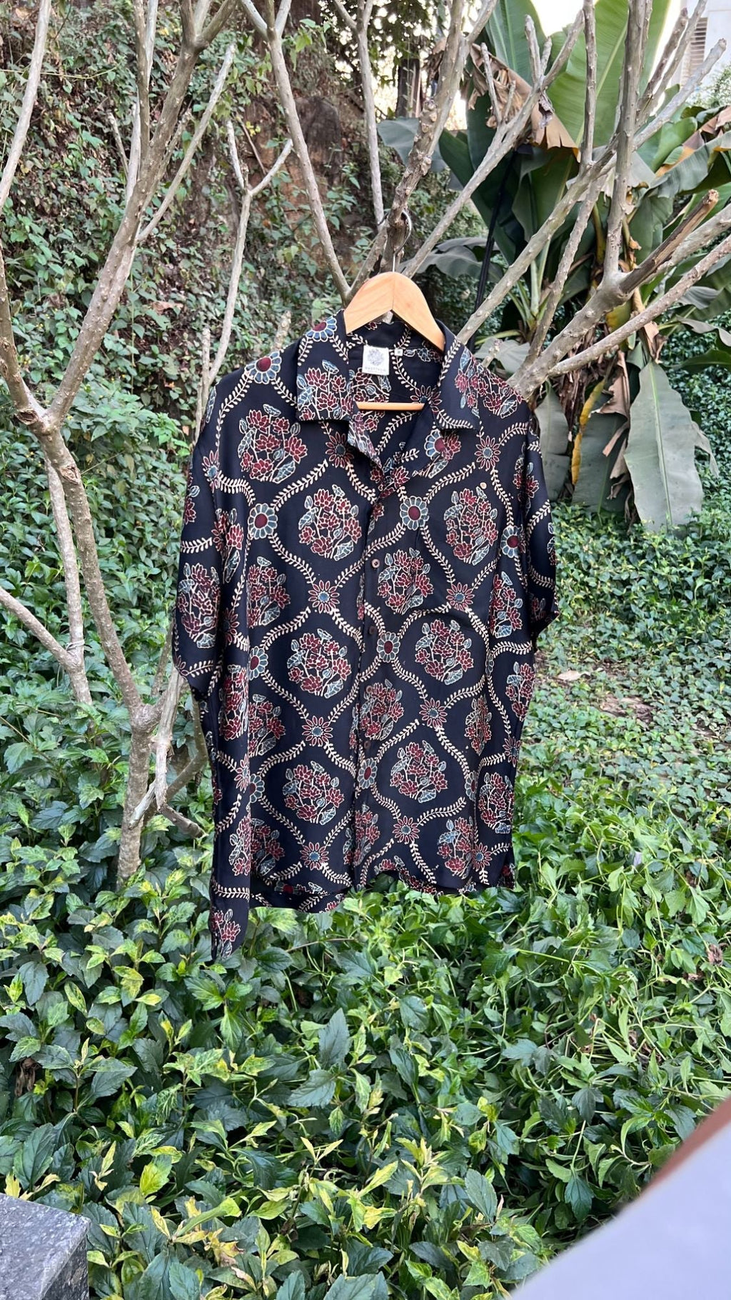 Black Hand Block Printed Shirt at Kamakhyaa by Hasttvam. This item is Black, Casual Wear, Floral, Handmade by Artisans, Modal silk, Natural dyes, Relaxed Fit, Respondible production and Vegan