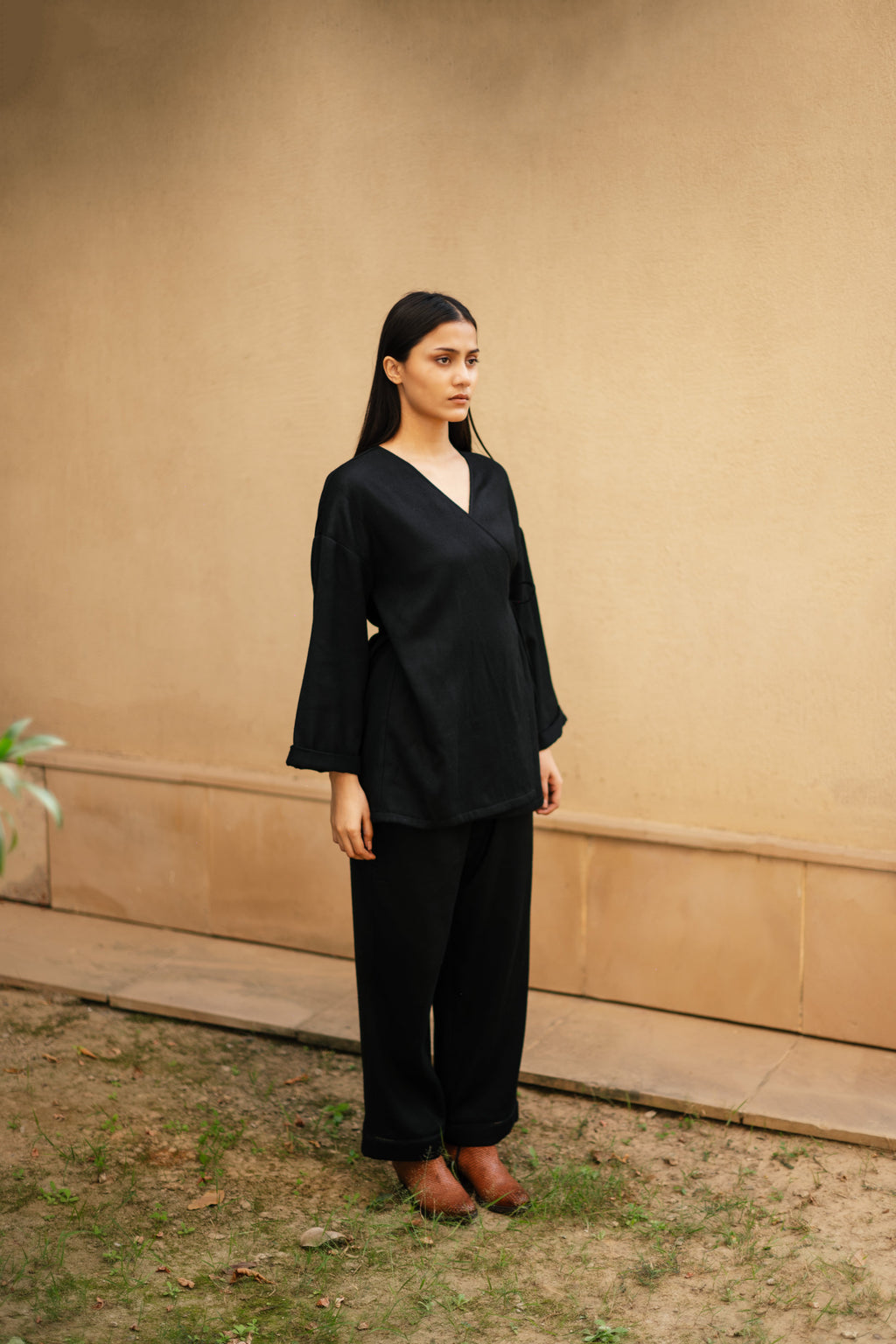Black Merino Wool Pansy Top at Kamakhyaa by Raas. This item is Black, Merino Wool, Regular Fit, Tunic Tops, Uru by Raas, Winter Wear, Woven