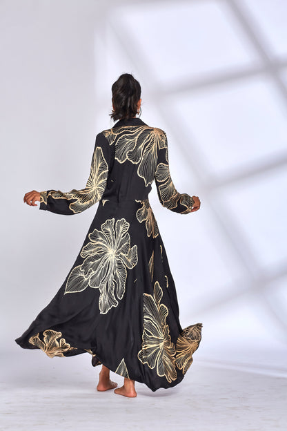 Black Printed Long Shirt Dress at Kamakhyaa by Hasttvam. This item is Black, Floral, Fusion Wear, Handmade by Artisans, Modal silk, Natural dyes, Printed, Respondible production and Vegan