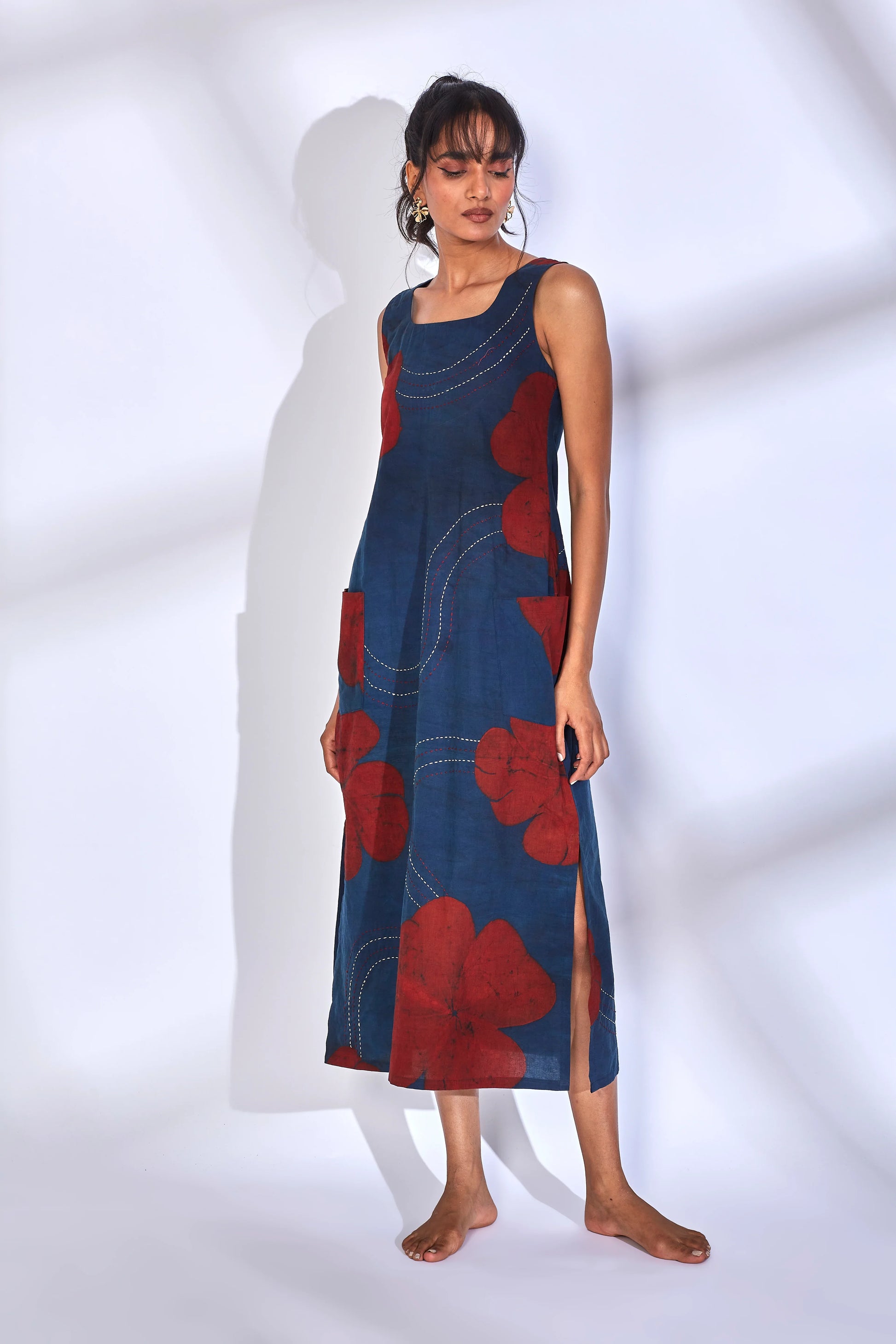 Blue Printed Midi Dress with side slit at Kamakhyaa by Hasttvam. This item is Cotton, Floral, Fusion Wear, Indigo, Natural dyes, Relaxed Fit, Respondible production and Vegan