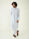 Blue Regular Fit Kurta Set at Kamakhyaa by RoohbyRidhimaa. This item is Blue, Festive Wear, Kurta Pant Sets, Men Kurta Pant Sets, Menswear By RoohbyRidhimaa, Qala By RoohbyRidhimaa, Regular Fit, Solids, Viscose Raw Silk