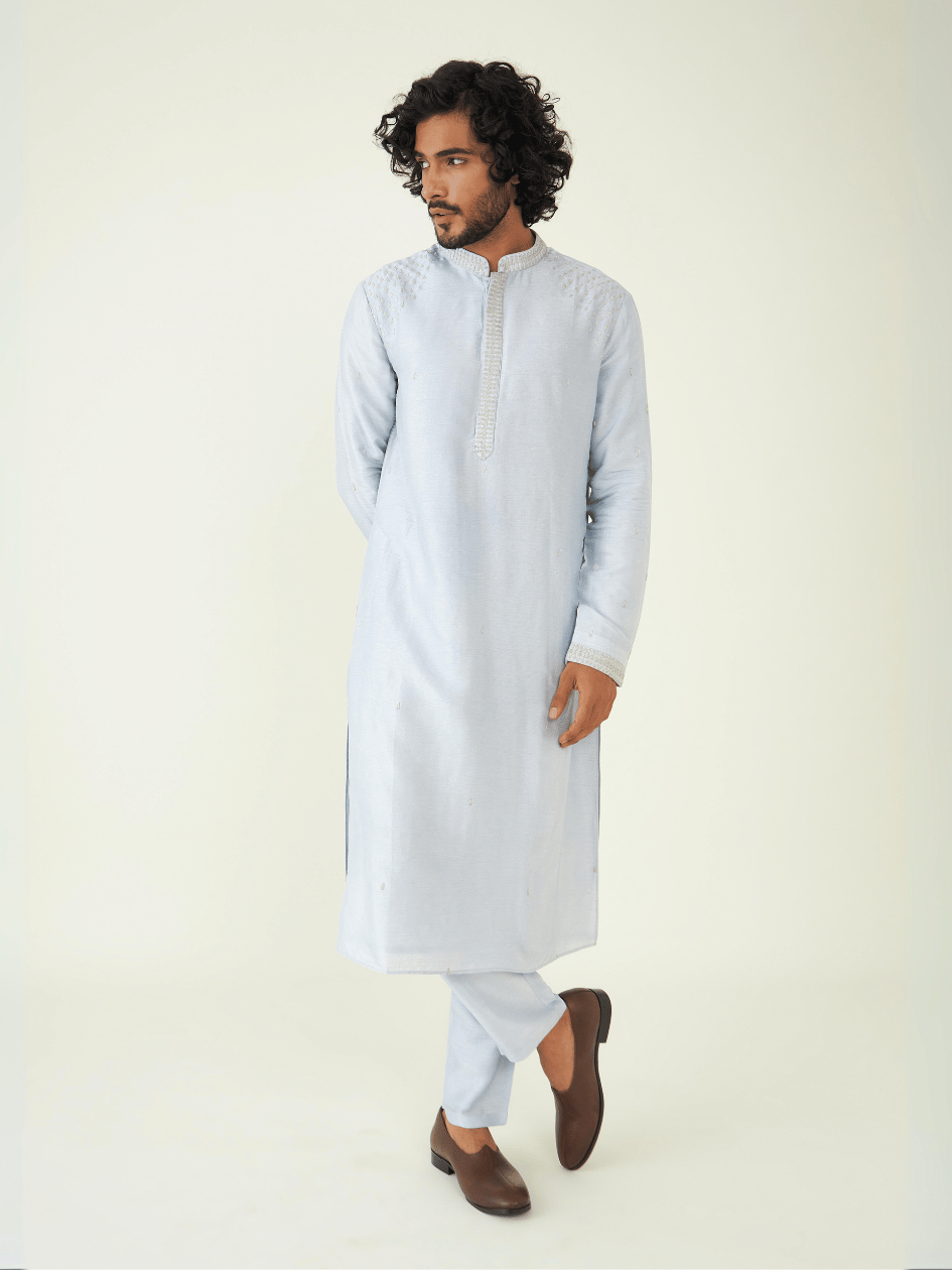 Blue Regular Fit Kurta Set at Kamakhyaa by RoohbyRidhimaa. This item is Blue, Festive Wear, Kurta Pant Sets, Men Kurta Pant Sets, Menswear By RoohbyRidhimaa, Qala By RoohbyRidhimaa, Regular Fit, Solids, Viscose Raw Silk