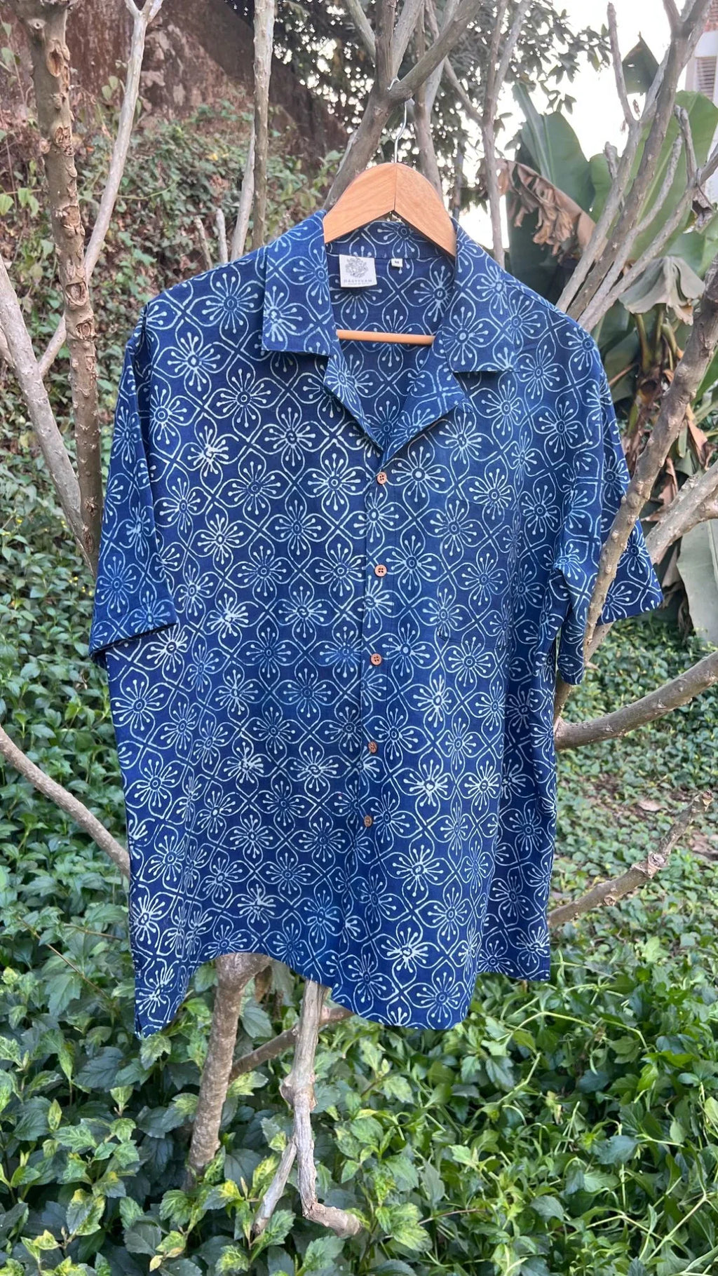 Blue Shirt with Ajrakh print at Kamakhyaa by Hasttvam. This item is Casual Wear, Cotton, Floral, Handmade by Artisans, Indigo, Natural dyes, Relaxed Fit, Respondible production and Vegan