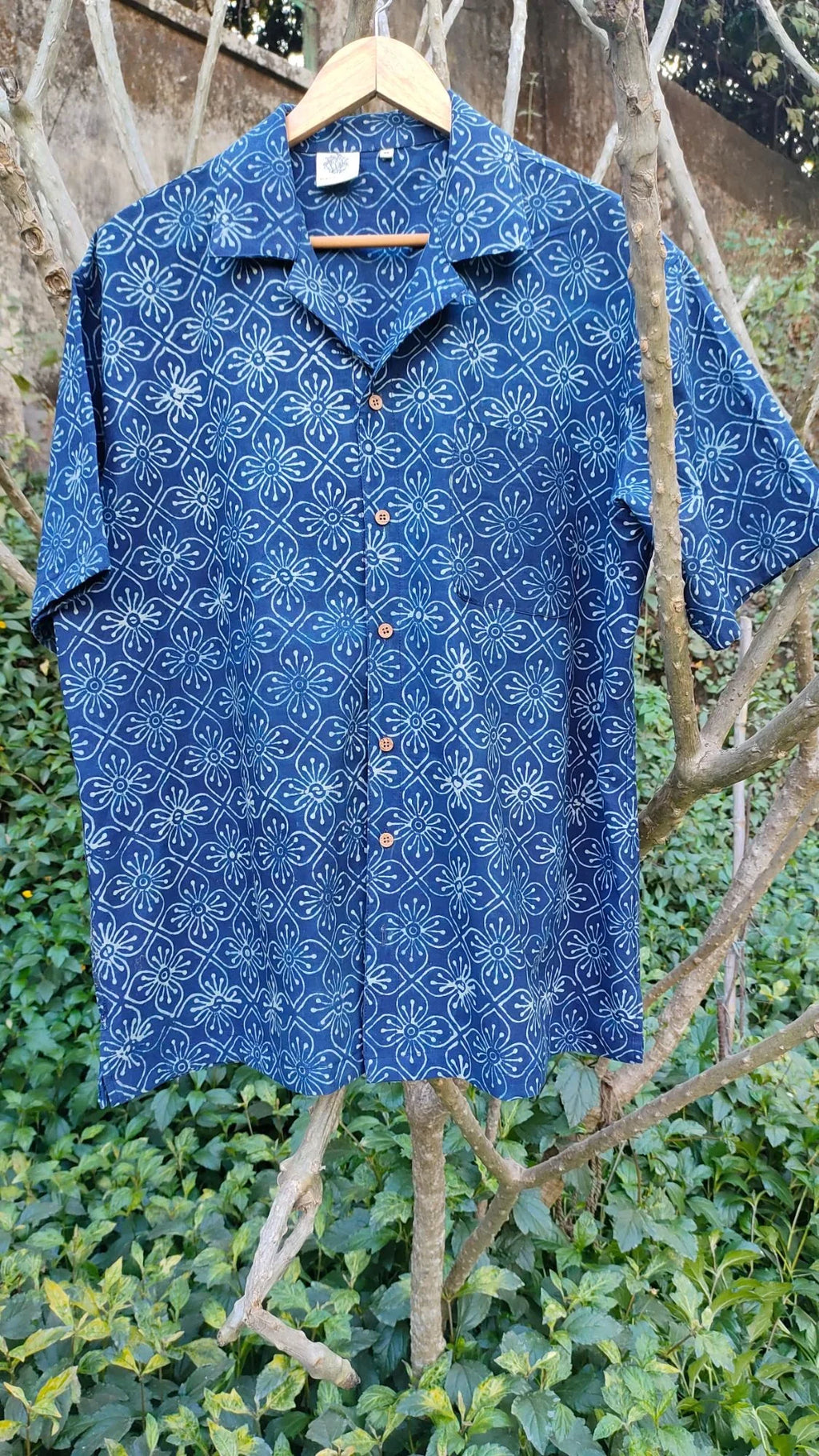 Blue Shirt with Ajrakh print at Kamakhyaa by Hasttvam. This item is Casual Wear, Cotton, Floral, Handmade by Artisans, Indigo, Natural dyes, Relaxed Fit, Respondible production and Vegan