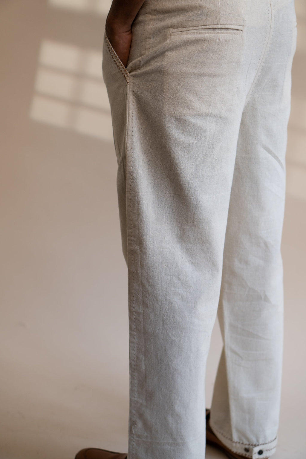 Dawning Pleated Pants at kamakhyaa.com by Lafaani. This item is 100% Cotton, Beige, Casual Wear, Clothing by Lafaani, Dawning by Lafaani, Denim, Embroidered, For Father, For Him, Handwoven Cotton, Kora, Men Shirts, Menswear, Natural, Rakhi Special, Regular Fit, Shirts, Tops, Under $200