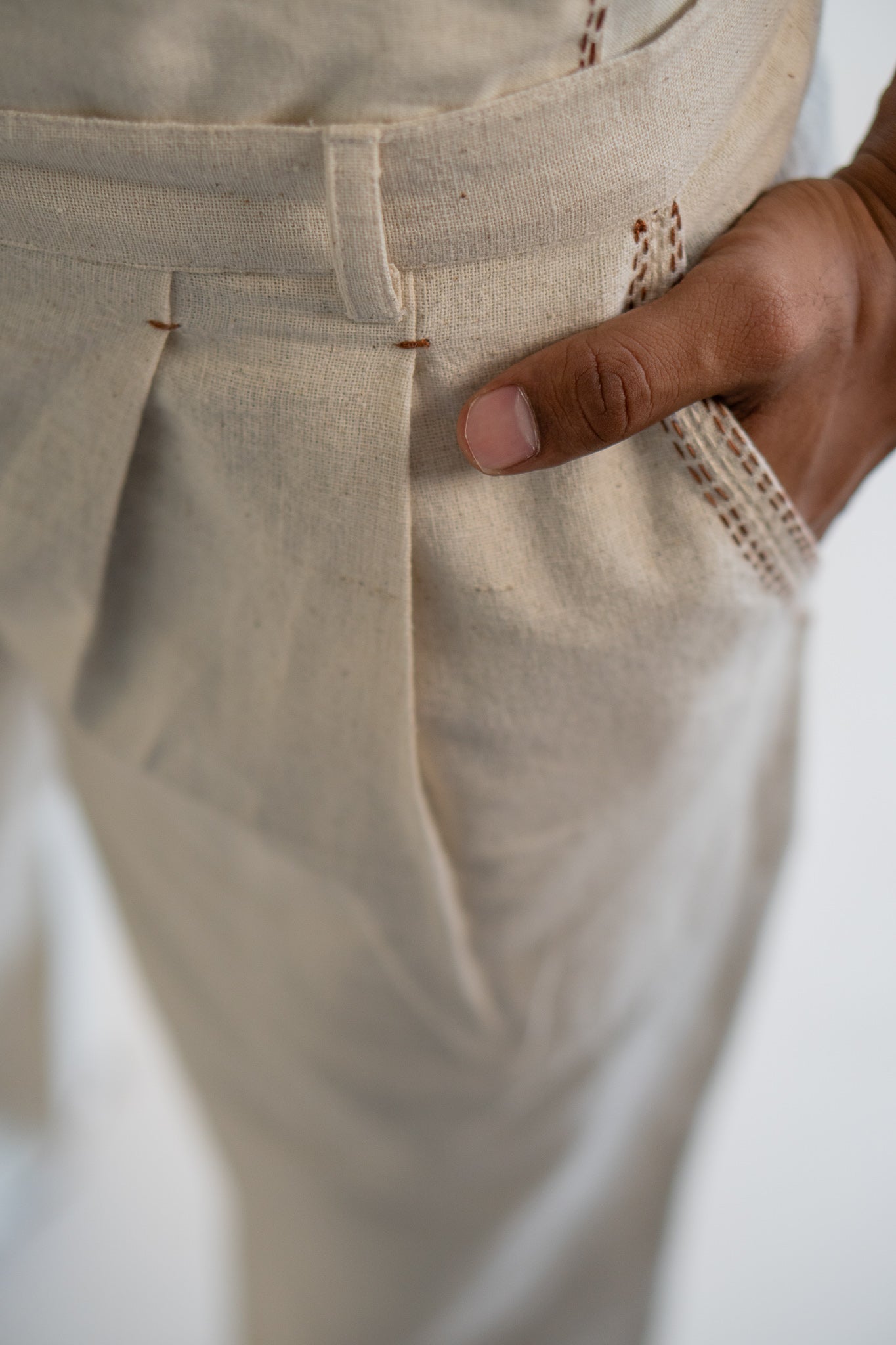 Dawning Pleated Pants at kamakhyaa.com by Lafaani. This item is 100% Cotton, Beige, Casual Wear, Clothing by Lafaani, Dawning by Lafaani, Denim, Embroidered, For Father, For Him, Handwoven Cotton, Kora, Men Shirts, Menswear, Natural, Rakhi Special, Regular Fit, Shirts, Tops, Under $200