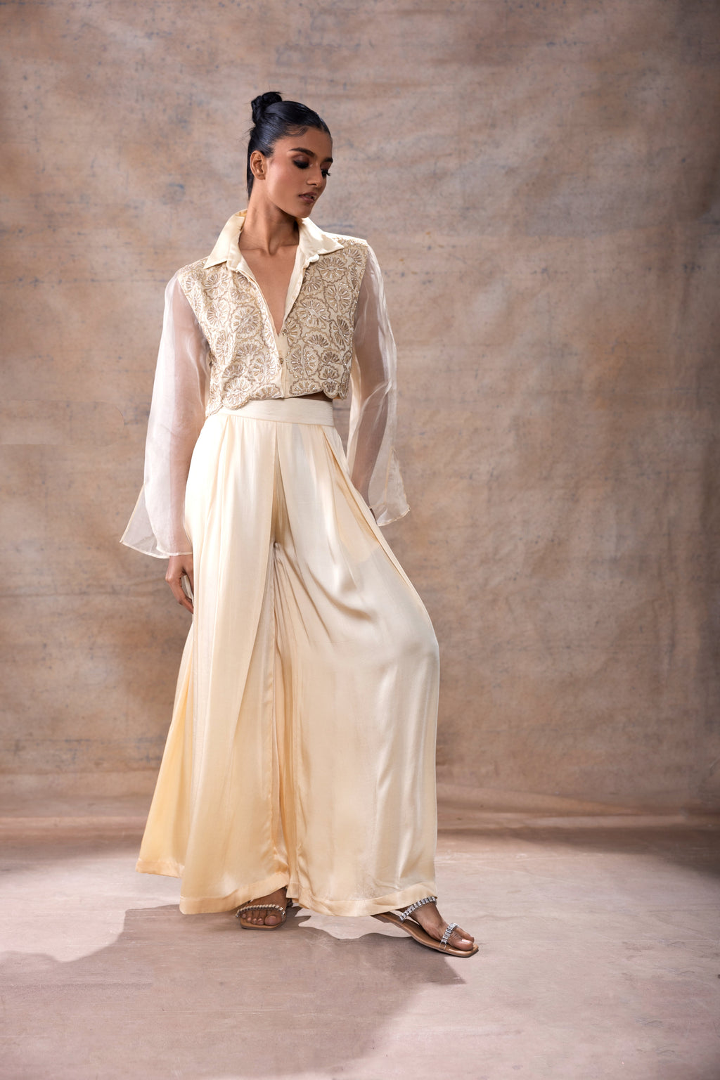 Emboridered Crop Shirt with Flared Pant Set at Kamakhyaa by Akashi Clothing. This item is Co-ord Sets, Evening Wear, Festive Wear, Hand Embroidered, missing, Modal Satin, Off-white, Organza, Party Wear, Party Wear Co-ord Sets, Relaxed Fit, White, Womenswear, Zaira by Akashi Clothing