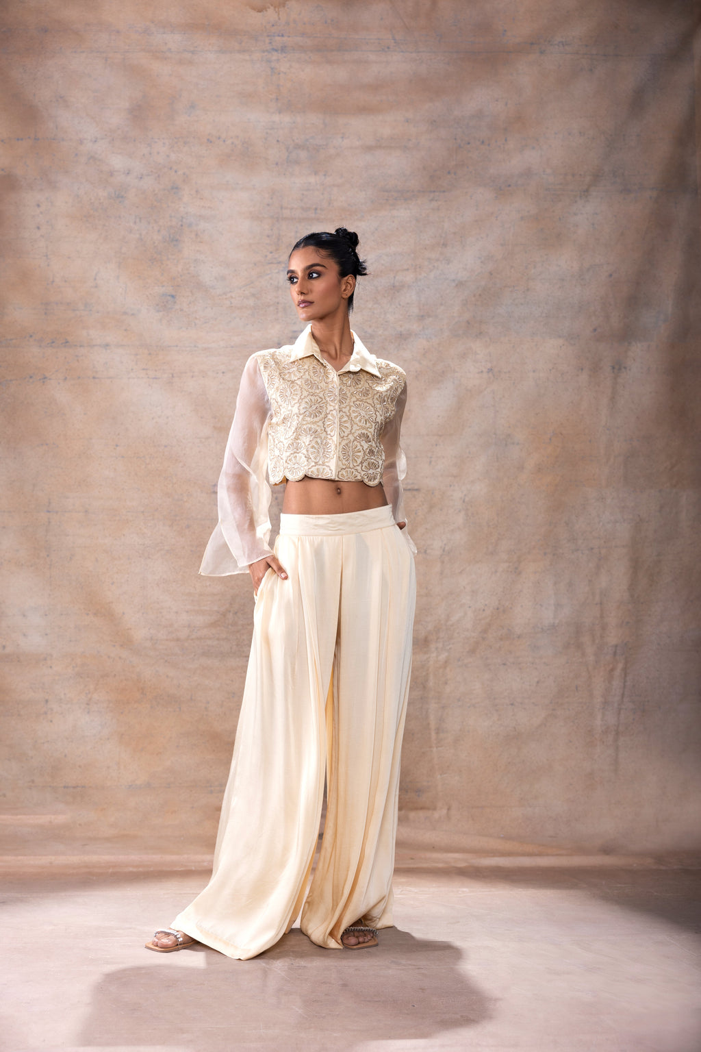 Emboridered Crop Shirt with Flared Pant Set at Kamakhyaa by Akashi Clothing. This item is Co-ord Sets, Evening Wear, Festive Wear, Hand Embroidered, missing, Modal Satin, Off-white, Organza, Party Wear, Party Wear Co-ord Sets, Relaxed Fit, White, Womenswear, Zaira by Akashi Clothing