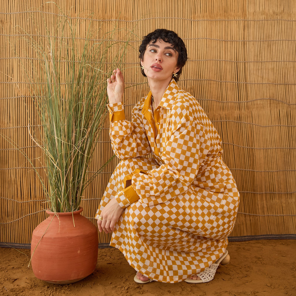 Golden Hour Gingham at Kamakhyaa by Taro. This item is Artisan made, Cotton Mulmul, Handblock Printed, Mustard, Orange, Shirt Dresses, Under $200, Whispers of Summer by Taro, Yellow