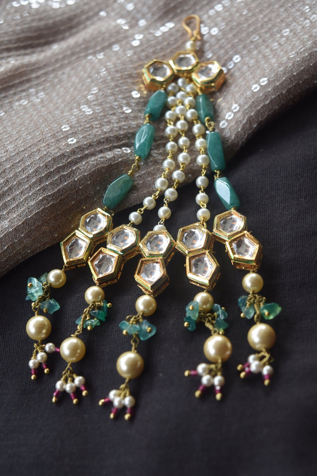 Green Choodamani passa at Kamakhyaa by House Of Heer. This item is Alloy Metal, Beaded Jewellery, Festive Jewellery, Festive Wear, Free Size, Gemstone, Green, jewelry, July Sale, July Sale 2023, Natural, Passas, Pearl, Polkis, Solids, Wedding Gifts