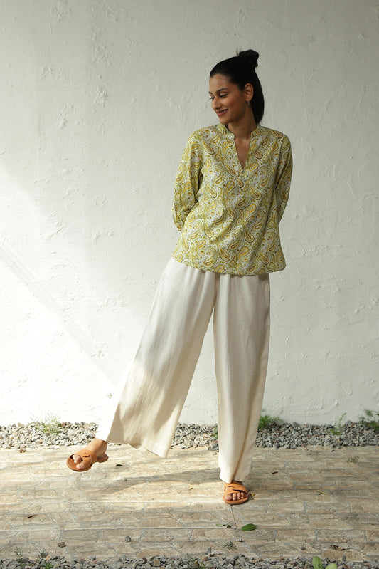 Green V Neck Shirt With White Pant Set at Kamakhyaa by Canoopi. This item is Canoopi, Casual Wear, Complete Sets, Cotton, Green, Natural, Prints, Rayon, Regular Fit, Vacation Co-ords, White, Womenswear