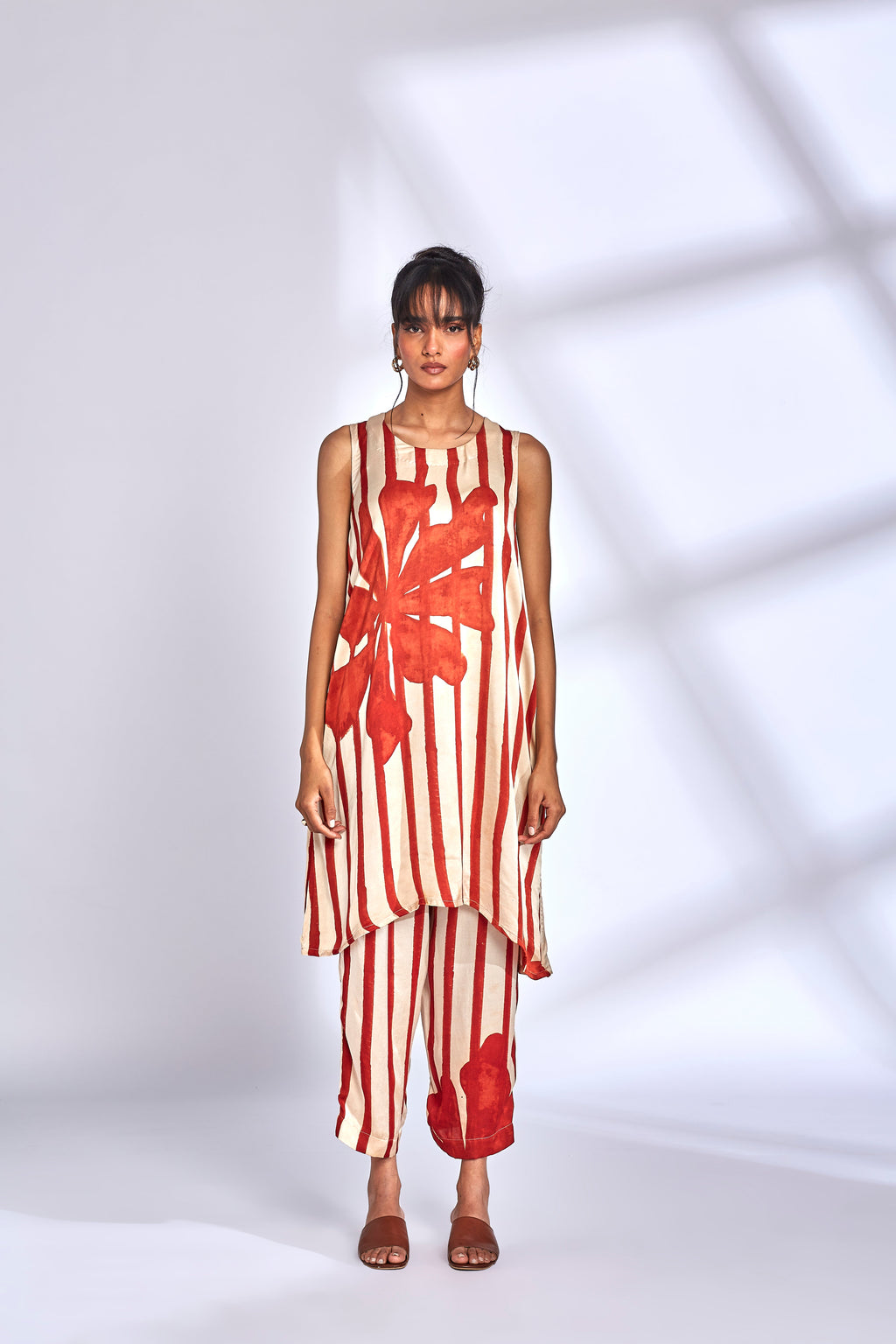 Hand-Painted Silk Kurta Set at Kamakhyaa by Hasttvam. This item is Floral, Fusion Wear, Handmade by Artisans, Modal silk, Natural dyes, Relaxed Fit, Respondible production and Vegan, White