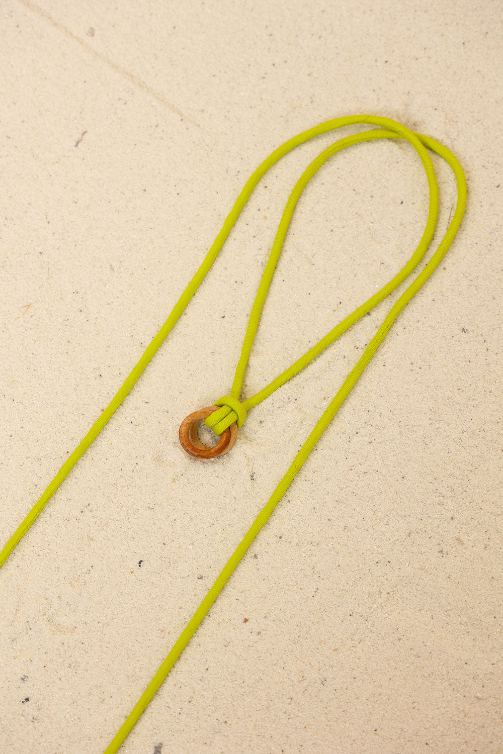 Lime Solid Twisted Thread Neckpiece at Kamakhyaa by Kanelle. This item is Evening Wear, Green, Made from Natural Materials, Neckpieces, One by One by Kanelle, One size, Tencel Twill, Wooden Ring