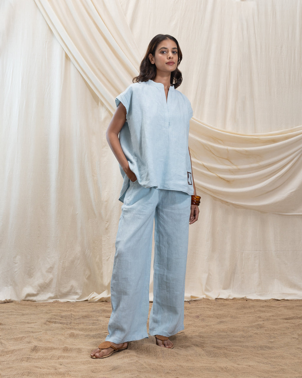 Linen v neck top and pleated drawsing pant set at Kamakhyaa by Akashi Clothing. This item is 100% Linen, Regular Fit, Solid Selfmade, Solids, The Stamp Edit By Akashi Clothing