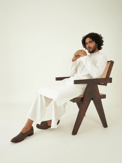 Off White Silk Kurta Set at Kamakhyaa by RoohbyRidhimaa. This item is Festive Wear, Kurta Pant Sets, Men Kurta Pant Sets, Menswear By RoohbyRidhimaa, Off white, Qala By RoohbyRidhimaa, Regular Fit, Solids, Viscose Raw Silk