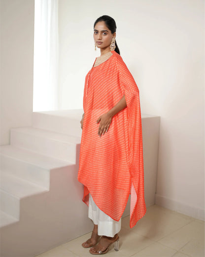 Orange Cowl Neck Bandhej Print Kurta Pant Set at Kamakhyaa by Mayura Kumar. This item is Bandhej, Bandhej Bandhini Mixology by Mayura Kumar, Dry clean, Festive Wear, Independence, Orange, Relaxed Fit, Satin Silk, Tie-Dye