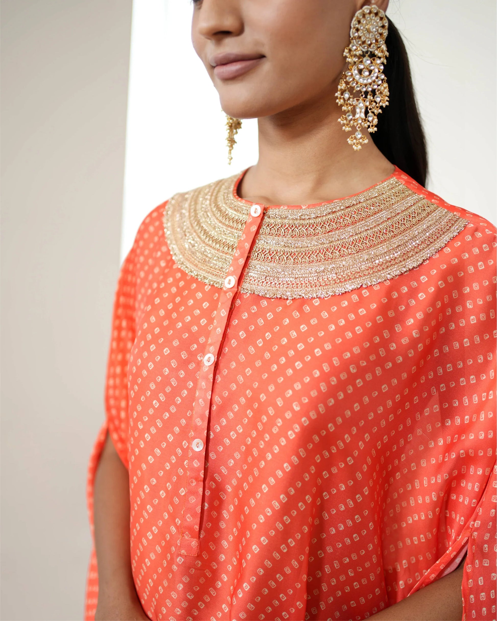 Orange Cowl Neck Bandhej Print Kurta Pant Set at Kamakhyaa by Mayura Kumar. This item is Bandhej, Bandhej Bandhini Mixology by Mayura Kumar, Dry clean, Festive Wear, Independence, Orange, Relaxed Fit, Satin Silk, Tie-Dye