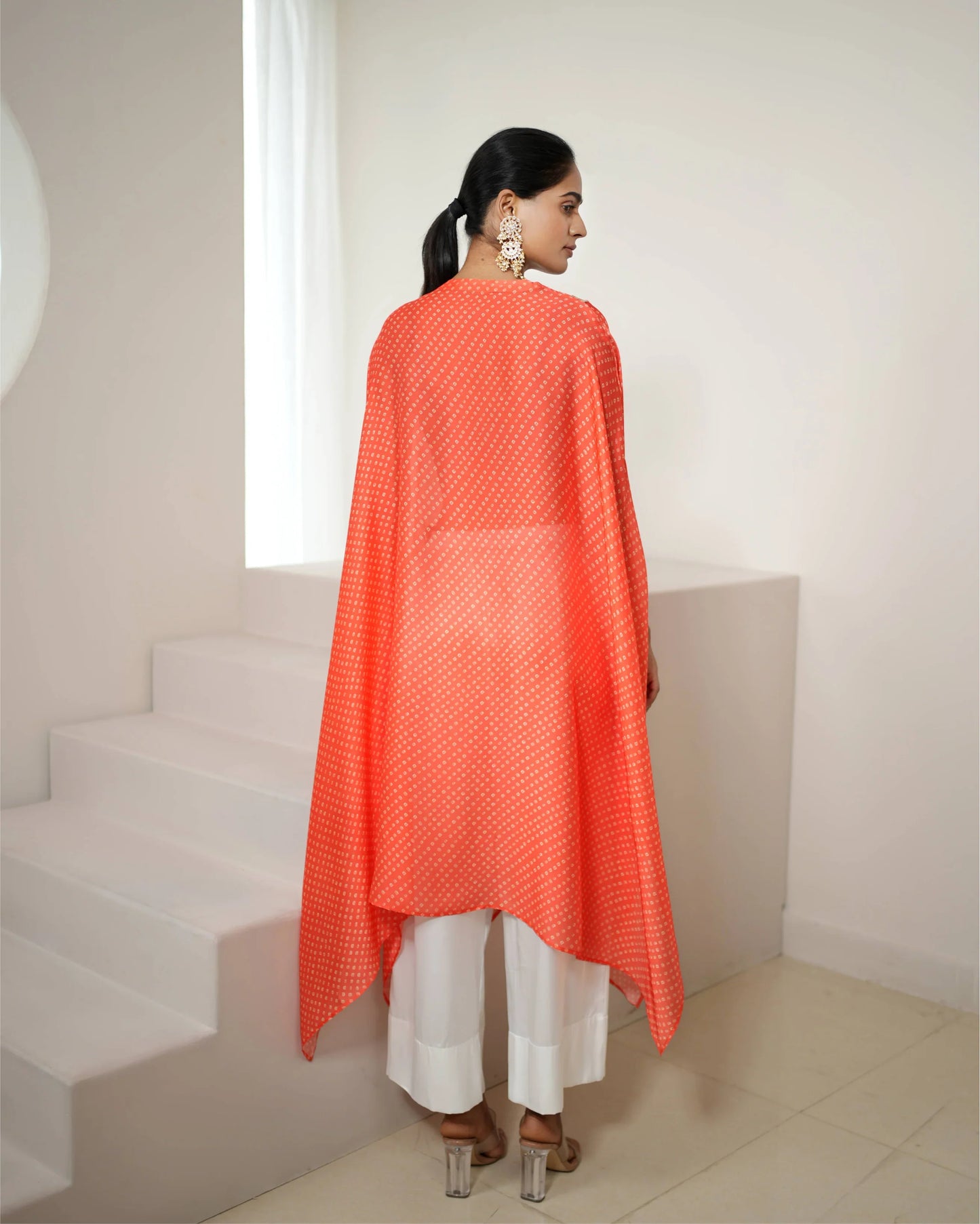 Orange Cowl Neck Bandhej Print Kurta Pant Set at Kamakhyaa by Mayura Kumar. This item is Bandhej, Bandhej Bandhini Mixology by Mayura Kumar, Dry clean, Festive Wear, Independence, Orange, Relaxed Fit, Satin Silk, Tie-Dye