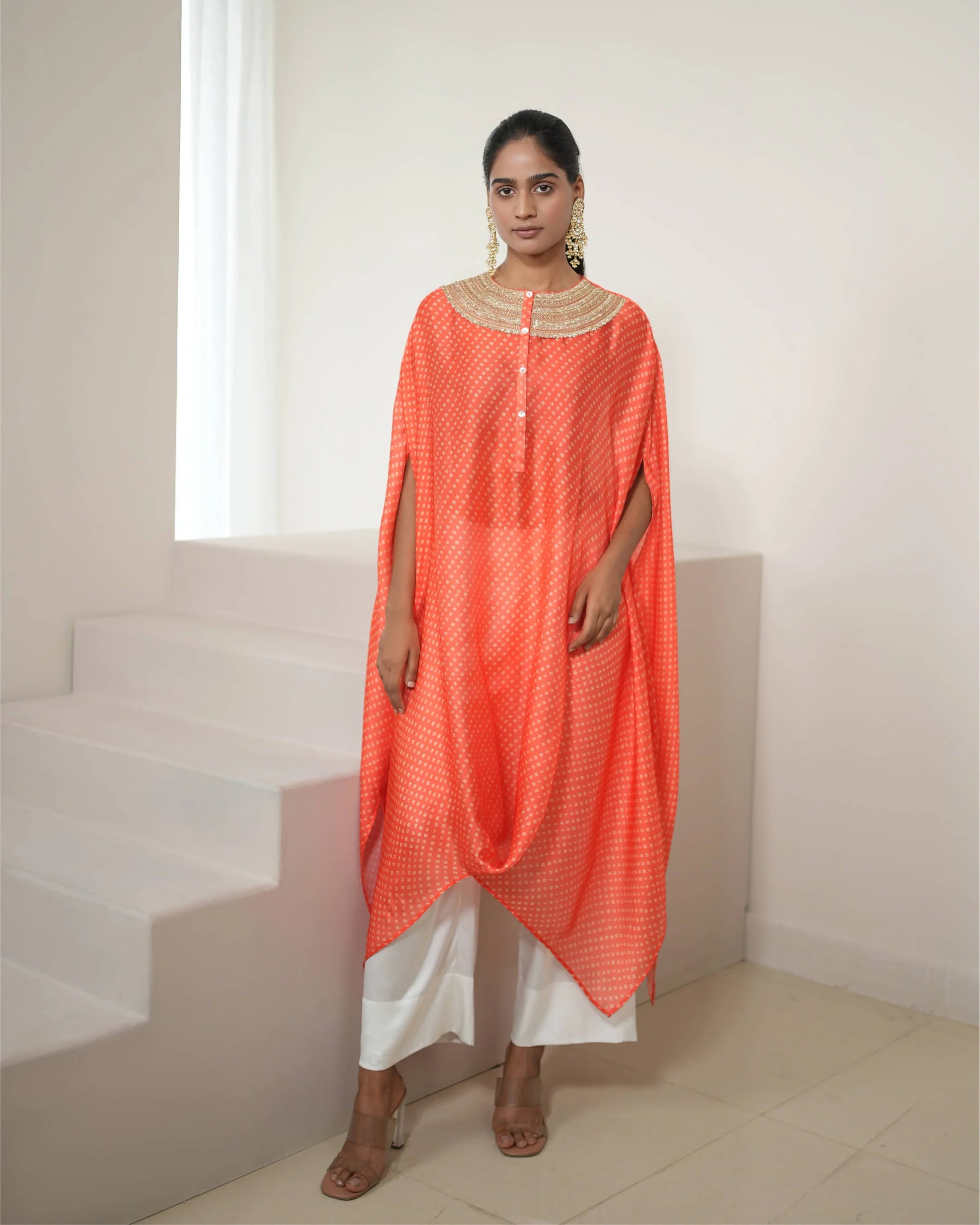 Orange Cowl Neck Bandhej Print Kurta Pant Set at Kamakhyaa by Mayura Kumar. This item is Bandhej, Bandhej Bandhini Mixology by Mayura Kumar, Dry clean, Festive Wear, Independence, Orange, Relaxed Fit, Satin Silk, Tie-Dye