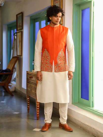 Orange Zari Embroidered Silk Jacket at Kamakhyaa by RoohbyRidhimaa. This item is Aangan By RoohbyRidhimaa, Festive Wear, Jackets, Men Jackets, Menswear By RoohbyRidhimaa, Orange, Regular Fit, Viscose Raw Silk, Zari Embroidered