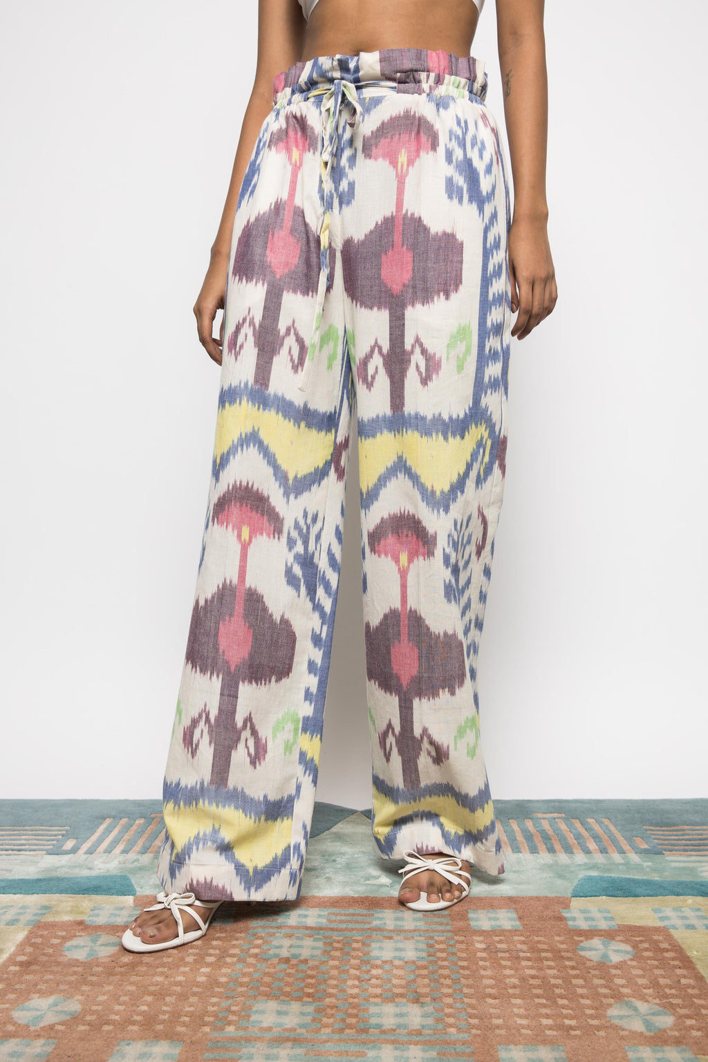 Paperbag Pants at kamakhyaa.com by Anushé Pirani. This item is 100% Cotton, Beach Wear, Brunch Wear, Casual Wear, Console Collection List, Cotton, Fresh Ink by Anushe Pirani, Handwoven cotton, Ikat Prints, Multicolor, Regular Fit, Resort Wear, Vacation Wear, Womenswear