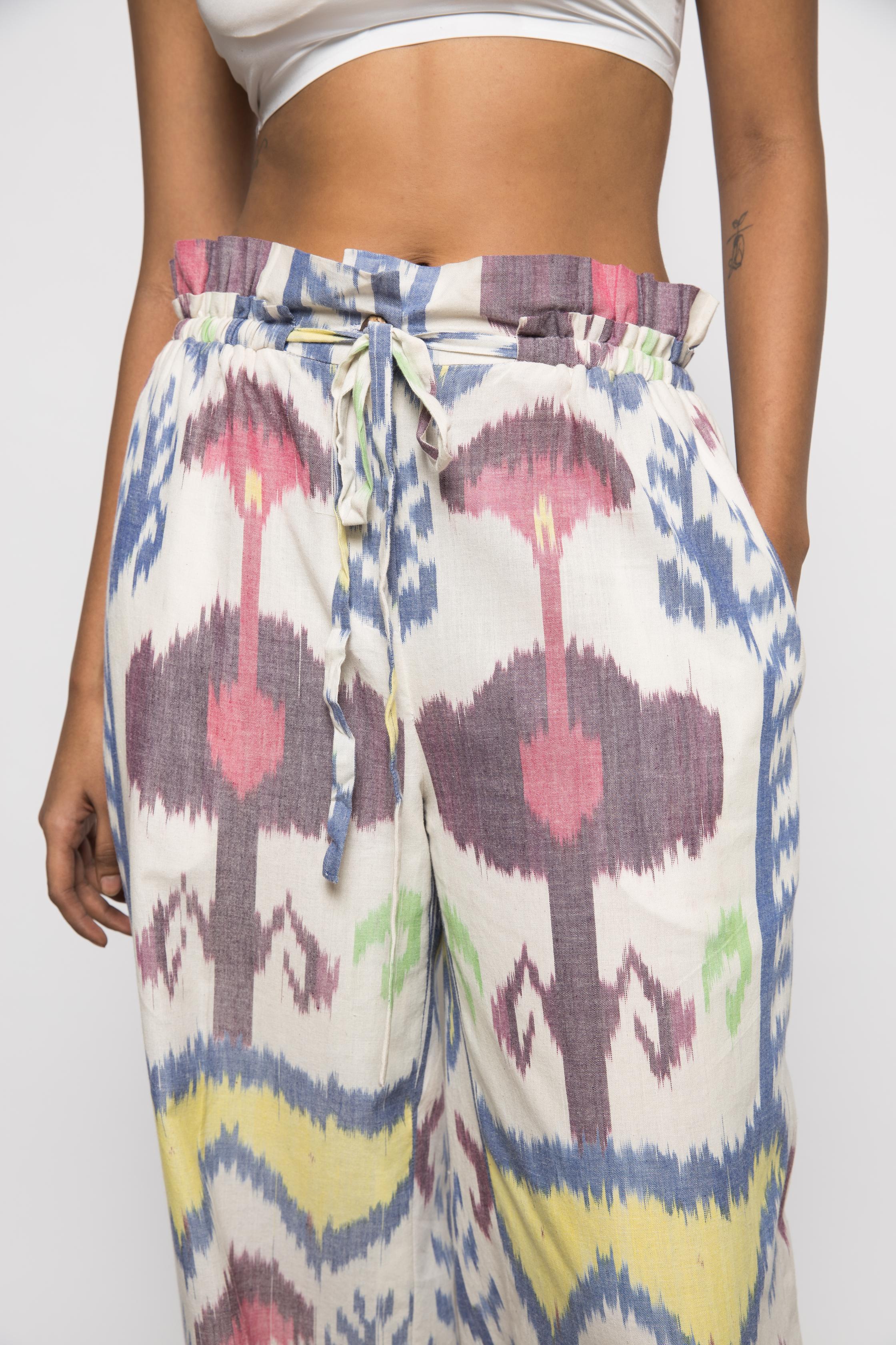 Paperbag Pants at kamakhyaa.com by Anushé Pirani. This item is 100% Cotton, Beach Wear, Brunch Wear, Casual Wear, Console Collection List, Cotton, Fresh Ink by Anushe Pirani, Handwoven cotton, Ikat Prints, Multicolor, Regular Fit, Resort Wear, Vacation Wear, Womenswear
