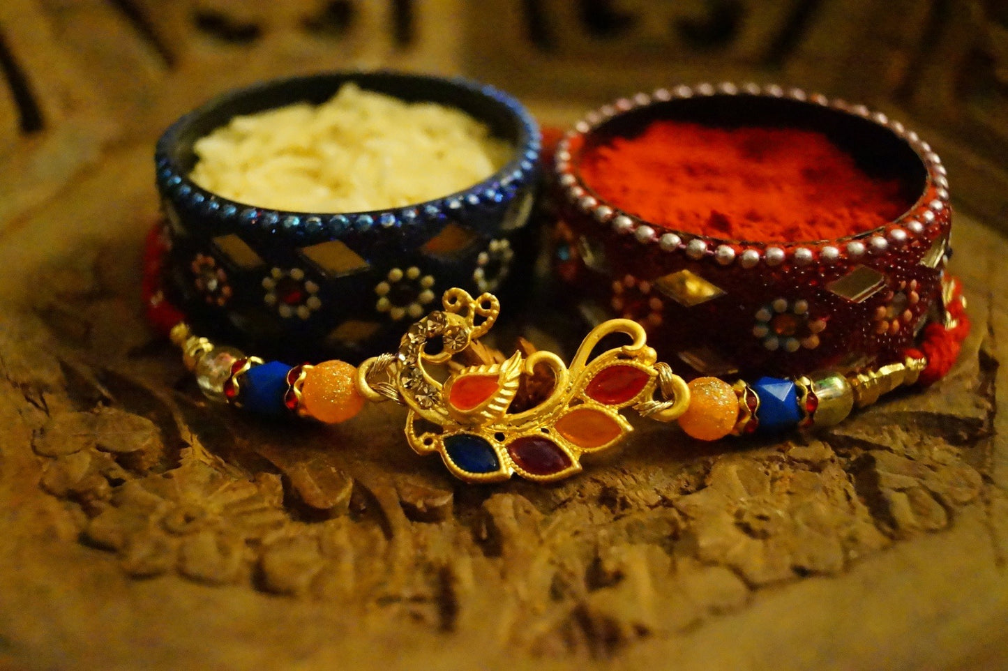 Peaccock Colorful Stone and Gold Brass Thread Rakhi at Kamakhyaa by Kamakhyaa. This item is Multicolor, Natural, Rakhi, Under 1500, Under 1750, Upcycled