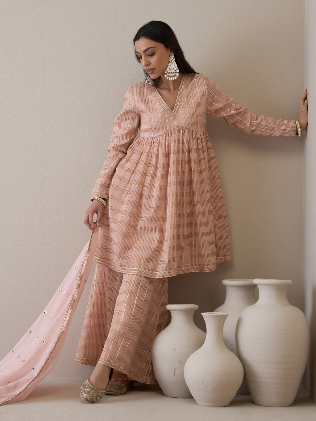 Peach Chanderi Silk Gota Embroidered Sharara Set at Kamakhyaa by RoohbyRidhimaa. This item is Avani by RoohbyRidhimaa, Chanderi Silk, Ethnic Wear, Gotta Embroidery, Pink, Relaxed Fit, Sequin Embroidered, Sharara Sets, Silk Chanderi, Silk Organza, Toxin free
