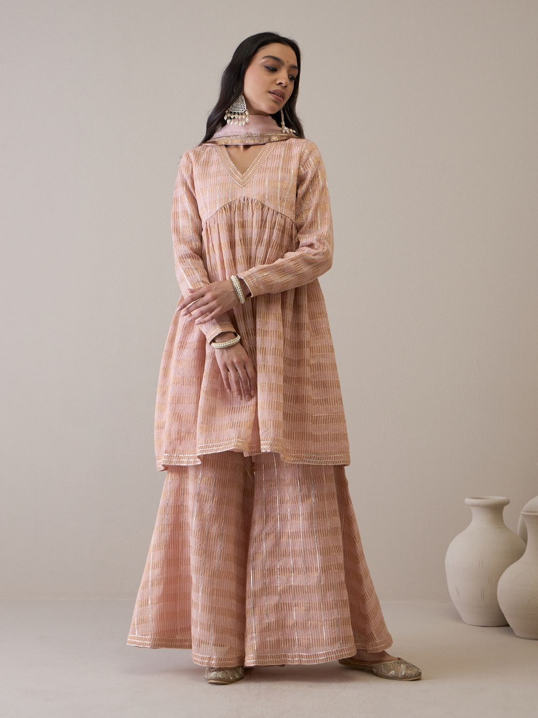 Peach Chanderi Silk Gota Embroidered Sharara Set at Kamakhyaa by RoohbyRidhimaa. This item is Avani by RoohbyRidhimaa, Chanderi Silk, Ethnic Wear, Gotta Embroidery, Pink, Relaxed Fit, Sequin Embroidered, Sharara Sets, Silk Chanderi, Silk Organza, Toxin free